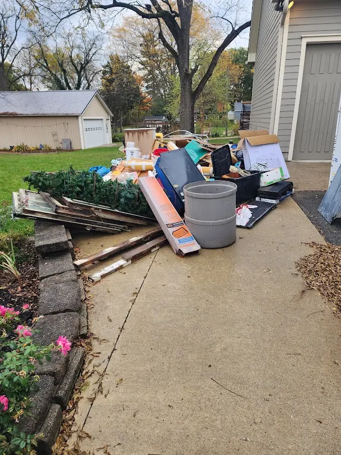 Dumpster being loaded with debris for Residential Dumpster Rental in Brookridge